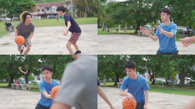 慢动作Z代亚裔中国少年在周末早上和朋友练习篮球比赛时打篮球