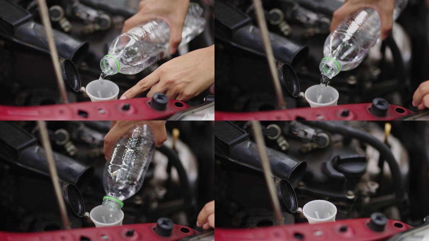 技工的手在加热的汽车散热器中加水的特写镜头。