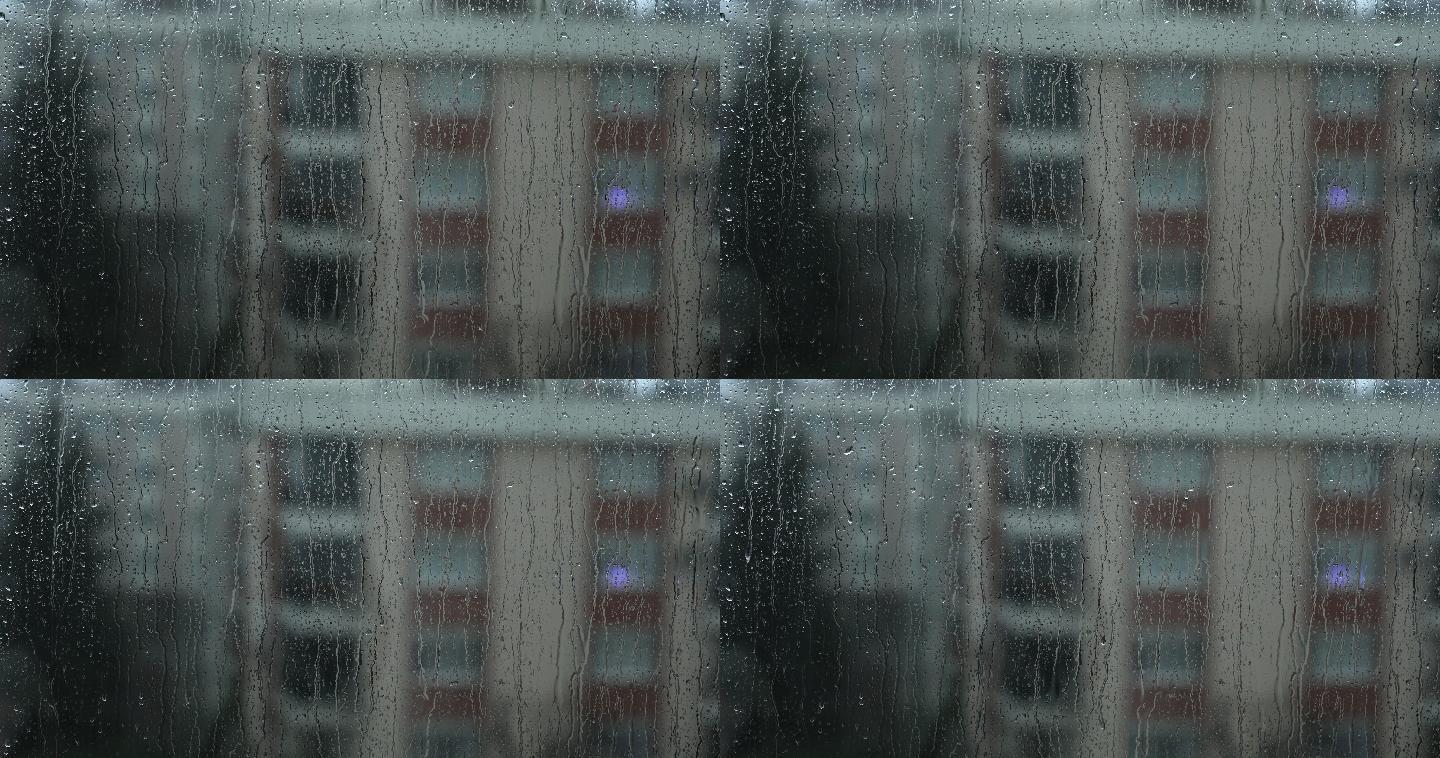 雨天透过窗外毛玻璃玻璃窗水珠雨痕