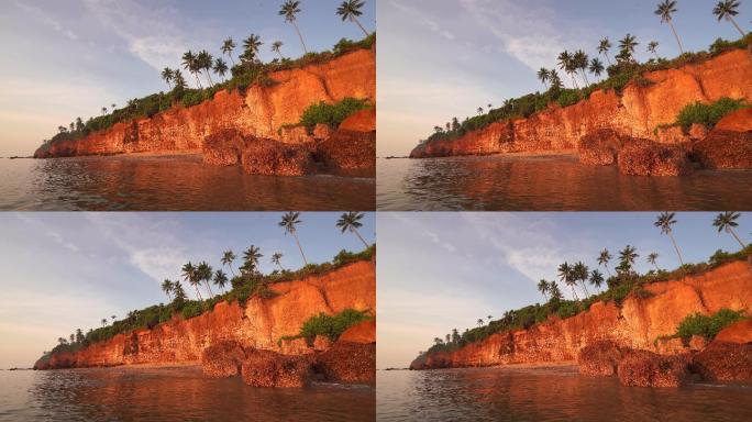 赤壁的日出景象，泰国普拉查普基里汗省泰国湾因风浪侵蚀形成的赤壁