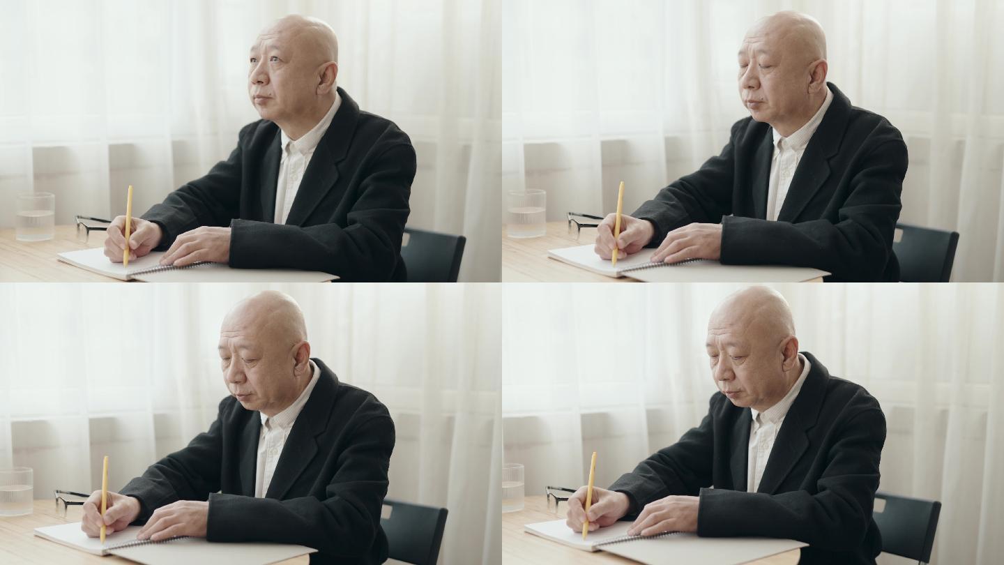 亚裔中国老人在办公室写字