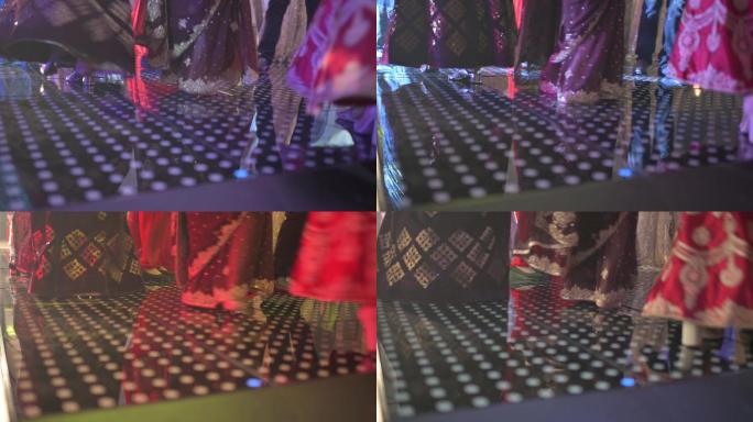 旁遮普省婚礼嘉宾在派对led灯后在舞池上跳舞