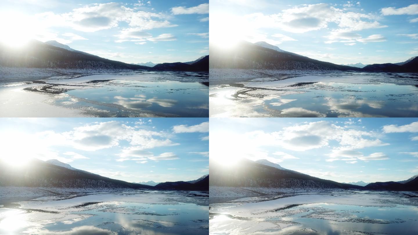 完美的阳光与湖面上的冰一起反射