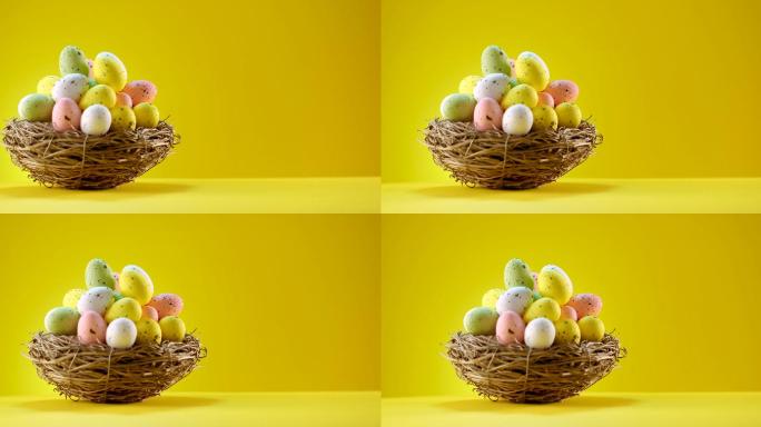 黄色背景的巢中的复活节彩蛋
