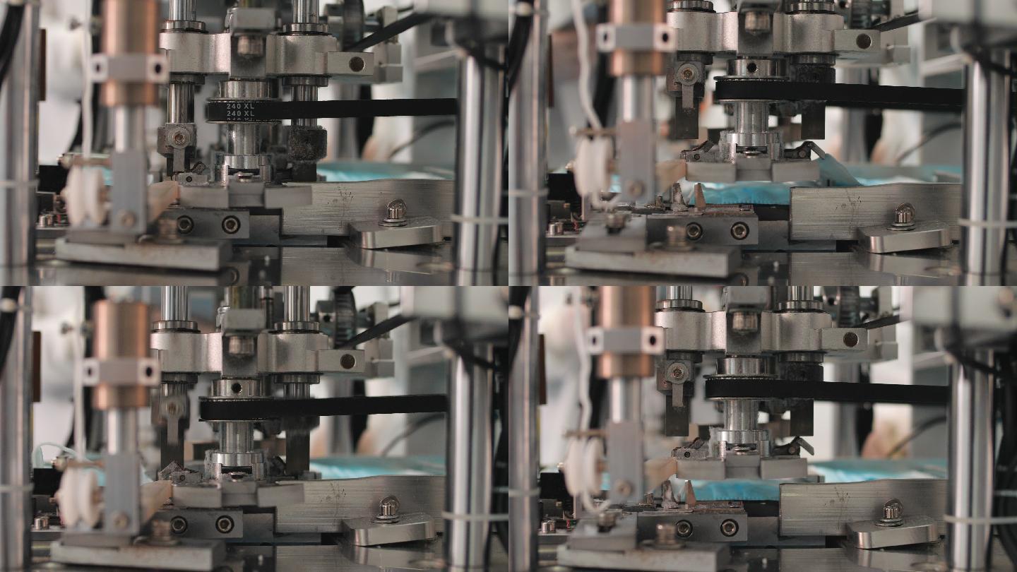 工厂机器正在争相生产口罩，生产医用三层蓝色或白色口罩。新口罩在传送带上移动。