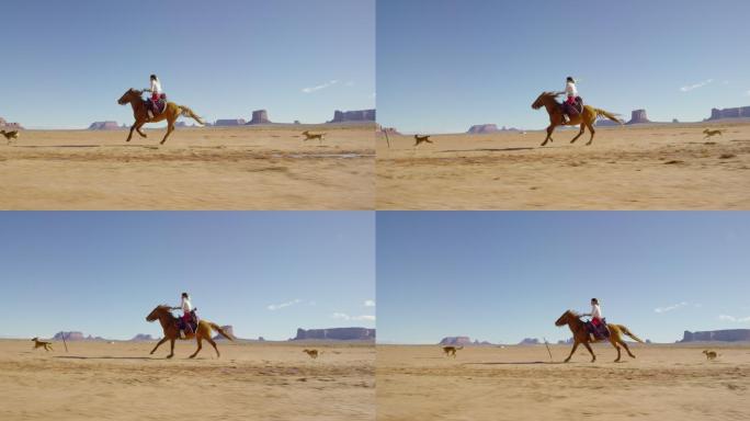 在一个晴朗的日子里，一个穿着传统纳瓦霍族服装的十几岁美国原住民女孩骑着她的马在纪念碑谷沙漠上疾驰，她
