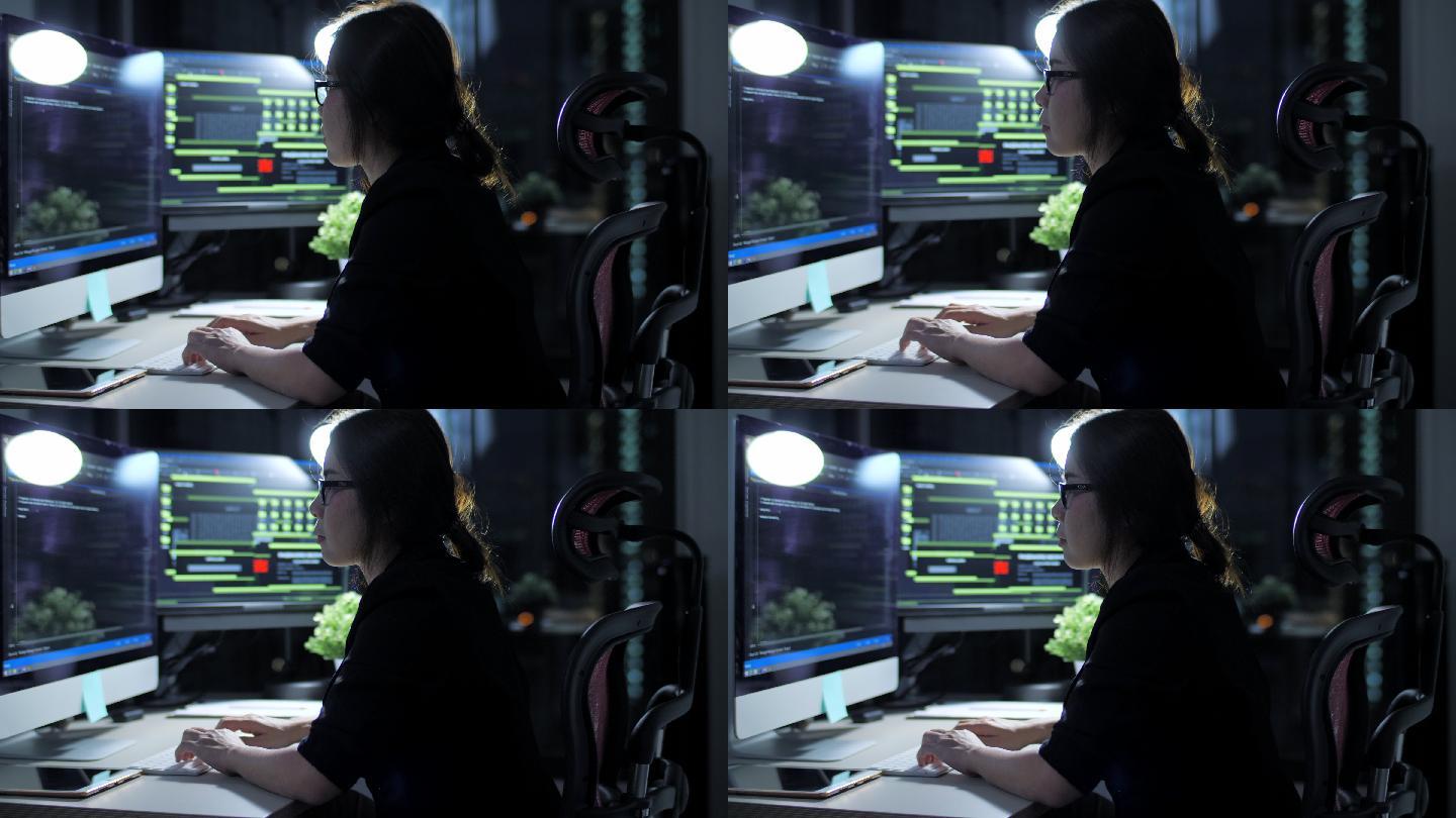 女性IT工程师在夜间工作并编写程序