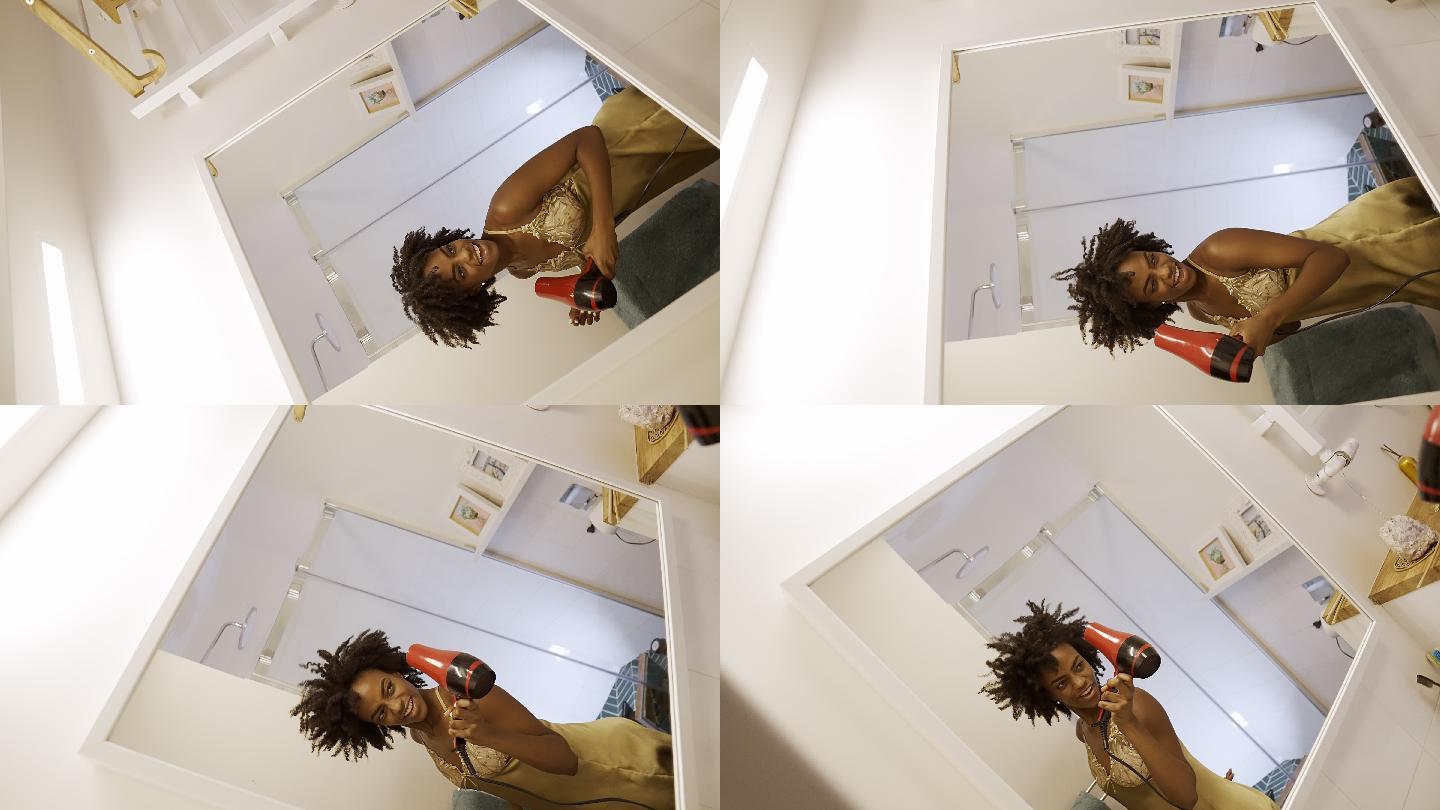 感觉棒极了。非洲裔女性喜欢早上上厕所，在镜子前玩得很开心。吹干头发跳舞