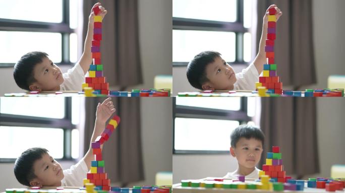 亚洲男孩学习英语字母、玩具和字母表。返校概念