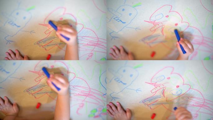 幼儿园孩子在白纸上画动物脸的俯视图。