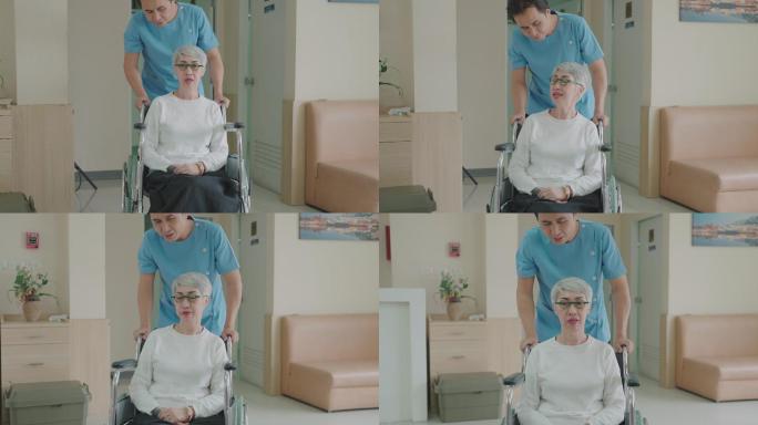 男护理助理坐轮椅关切地与患者交谈。在医院或诊所
