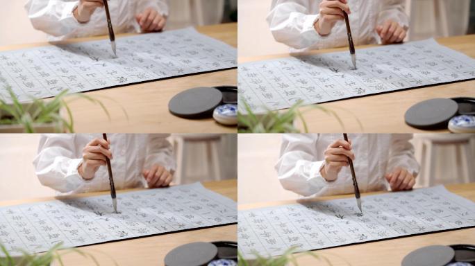 练习毛笔字的亚洲女孩特写