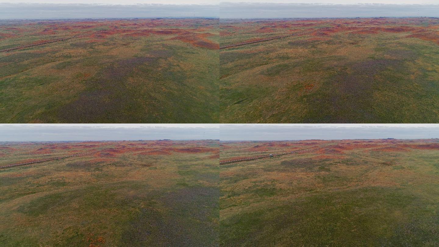 早春，蒙大拿州约旦附近草原上的红山。空中无人机视频画面，摄像头向前和向下移动。
