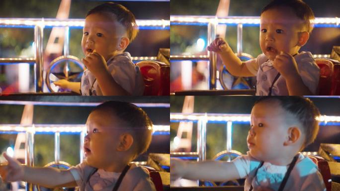 可爱的小男孩晚上在曼谷旅行