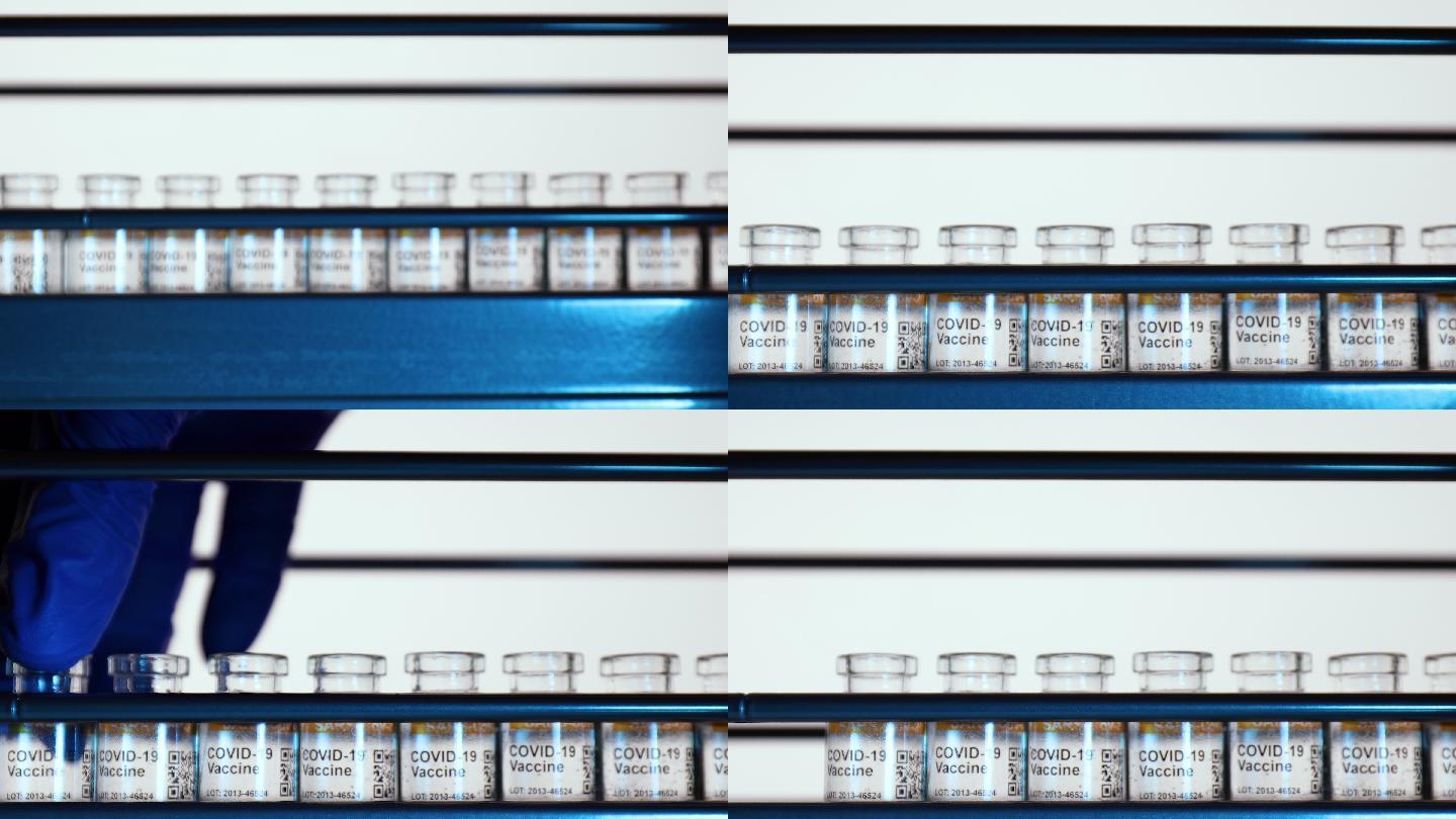 低温下装有一批2019冠状病毒疾病疫苗瓶的工业蓝色金属冷冻容器。标记SARS-CoV-2以对抗冠状病