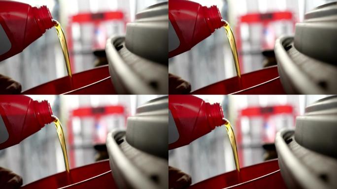 汽车的机油涌向汽车发动机。在给汽车换油的过程中注入了新鲜的油。