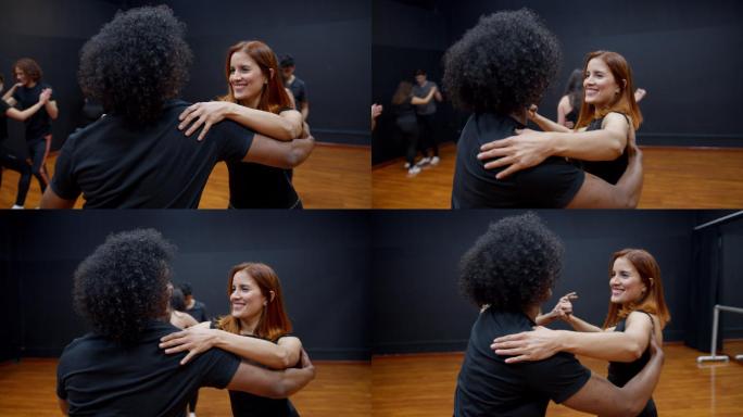拉丁美洲一对不同种族的夫妇在舞蹈课上玩得很开心，笑得很开心