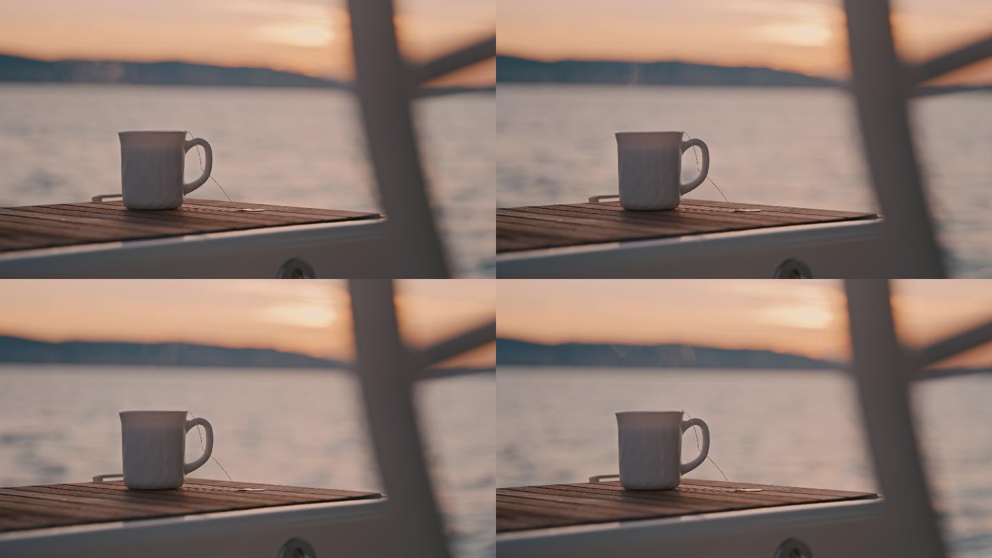 黄昏时分，帆船木质船尾上的一杯茶喷出蒸汽