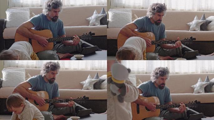 成熟的父亲在家照顾女儿时会弹吉他。
