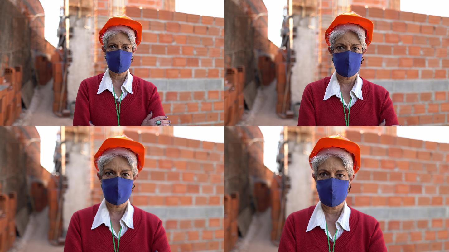 一名女性建筑工人在施工现场使用防护口罩的肖像