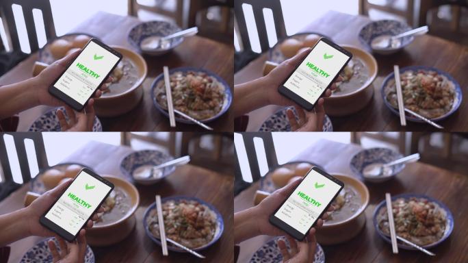 女性使用智能手机查看食物数据慢动作