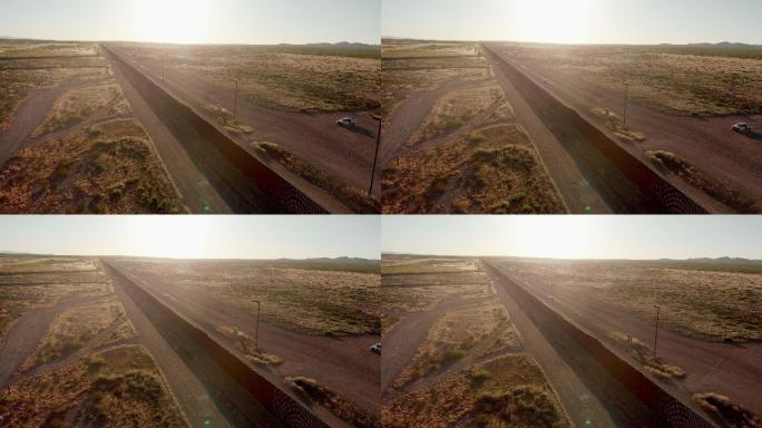 无人机4K日落画面，拍摄美国和墨西哥在帕洛马斯-奇瓦瓦和哥伦布-新墨西哥州交界处的边境墙