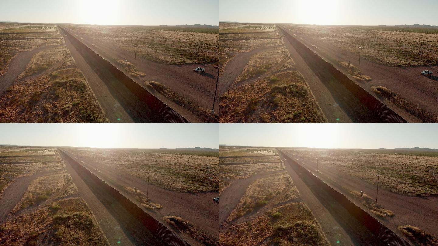 无人机4K日落画面，拍摄美国和墨西哥在帕洛马斯-奇瓦瓦和哥伦布-新墨西哥州交界处的边境墙