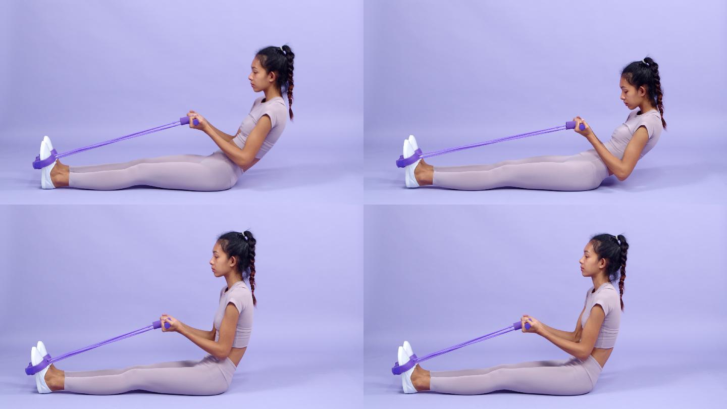 概念健身瑜伽锻炼。年轻苗条的亚洲女性穿着非常浅的紫色套装