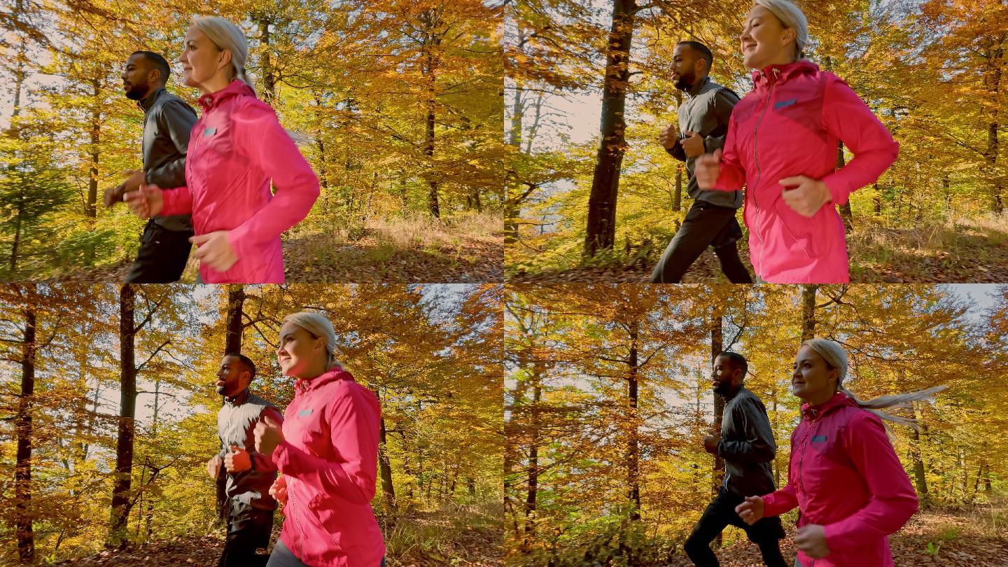 在一个阳光明媚的日子里，男人和女人在秋天的森林里奔跑