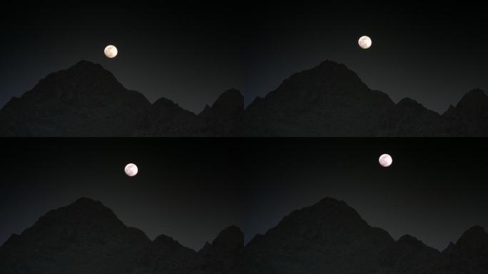 夜晚月亮从山边升起