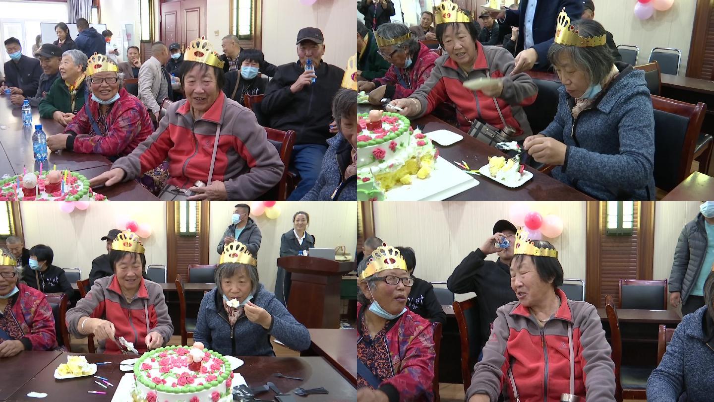 重阳节社区集体给老人过生日吃蛋糕吹蜡烛