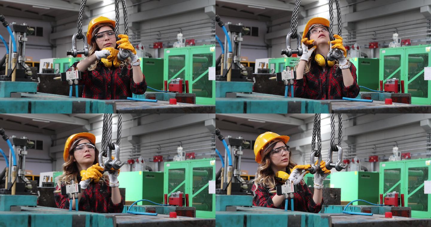 在工厂大楼工作的年轻漂亮的女工程师的肖像。
