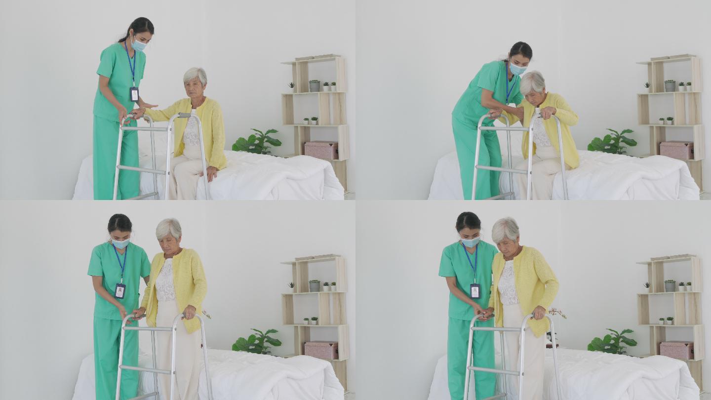 微笑的亚洲护士帮助老年妇女起床。护理人员在患者起床时为其提供支持，并在家中走向助行器。帮助年老的残疾