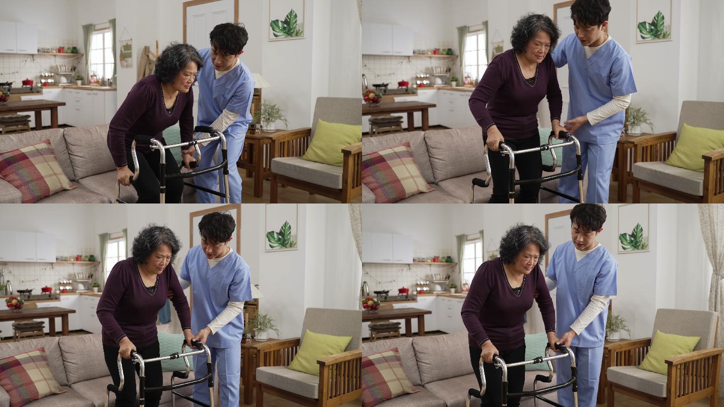 亚洲男性个人护理助理帮助虚弱的成熟女性在家里的客厅里与助行器一起行走。在家照顾受伤老人的理念