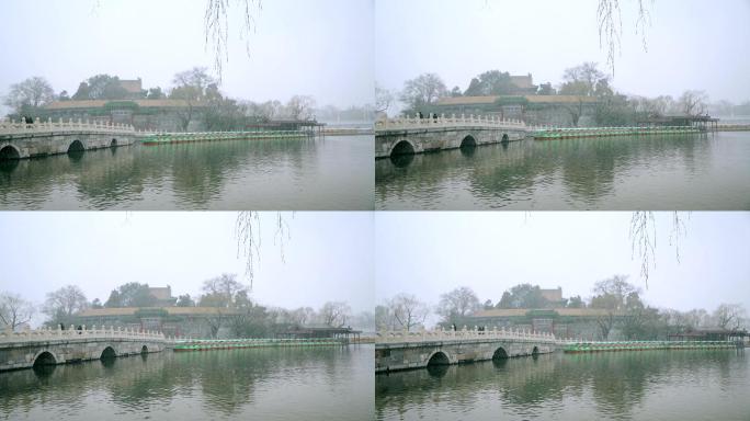 初春北京北海公园中式园林里飘落的雪花