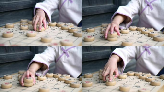 实拍升格穿中国传统服饰下中国象棋的女孩