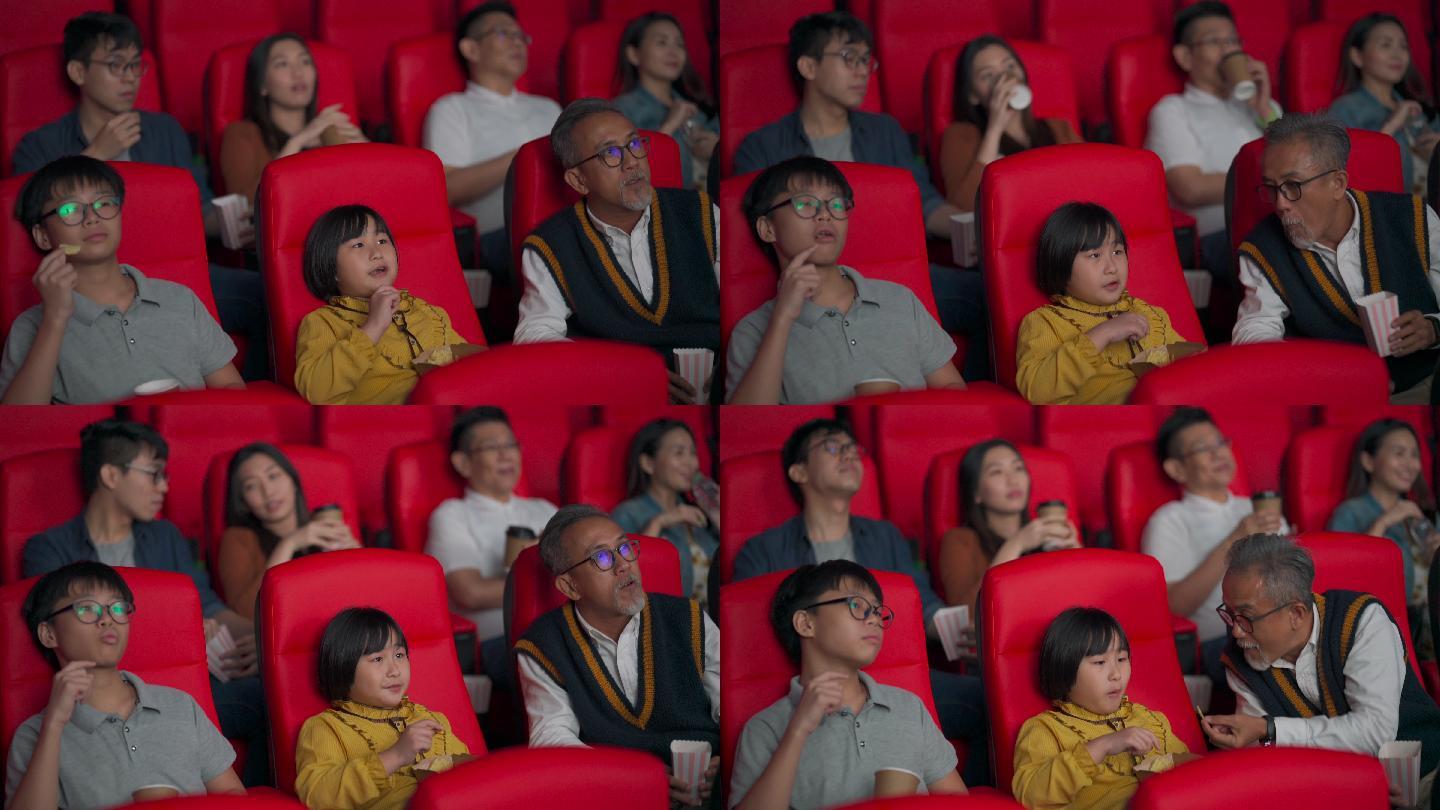亚裔华裔活跃老人和他的孙子们喜欢在电影院看电影