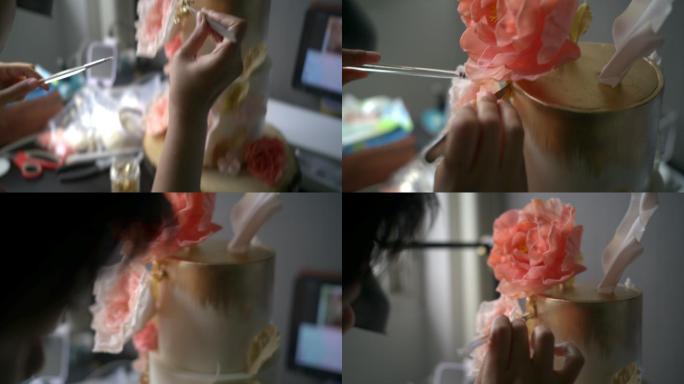 特写镜头：装饰树胶花蛋糕的女人