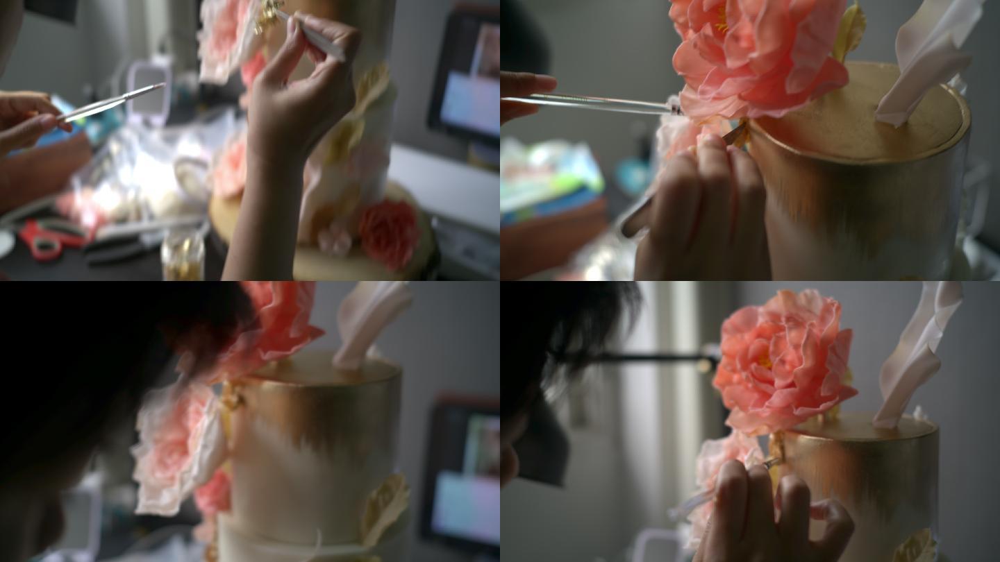 特写镜头：装饰树胶花蛋糕的女人