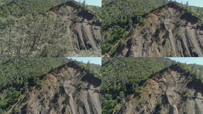加利福尼亚州拉姆西附近的卡什溪峡谷被泥石流摧毁的侵蚀山坡鸟瞰图。带有前向摄像头运动的无人机视频。