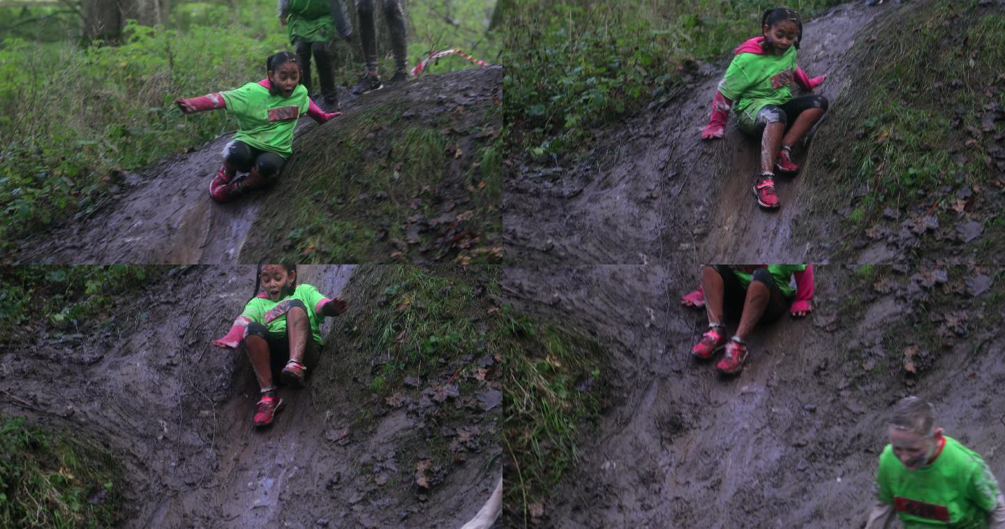 在泥泞中滑行孩童玩耍玩泥巴
