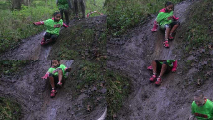 在泥泞中滑行孩童玩耍玩泥巴