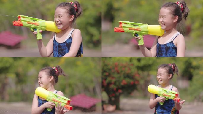在泼水节上，穿着传统泰国服装的孩子们玩水枪