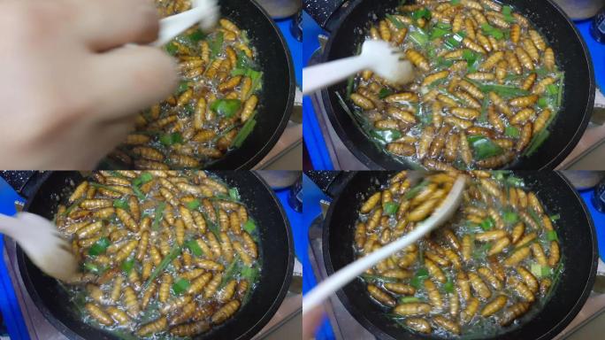 在锅里炸椰子虫蚕蛹