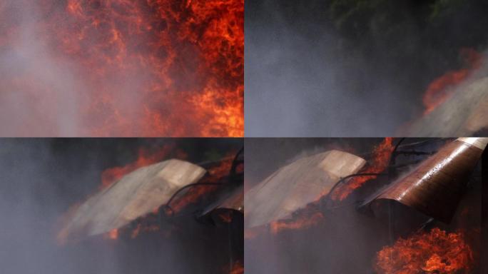 用建筑物和消防水带喷水的方式拍摄火焰