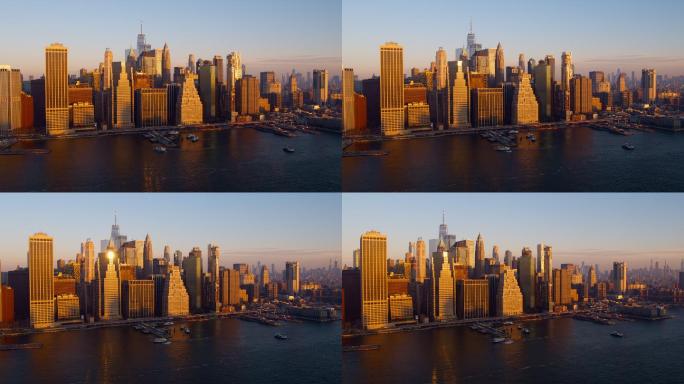 横跨东河的曼哈顿市中心鸟瞰图，船在黎明时分抵达和离开11号码头和炮台海事。无人机视频与平移小车相机运