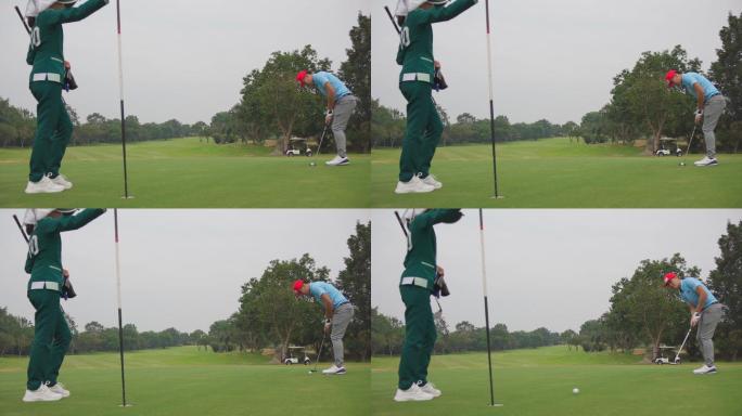 4K亚洲男子高尔夫球手在球道上把高尔夫球打过一个洞