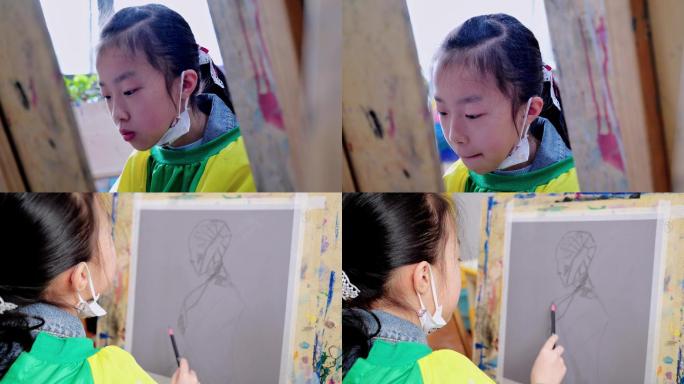 美术培训学校在画板前画画的女孩
