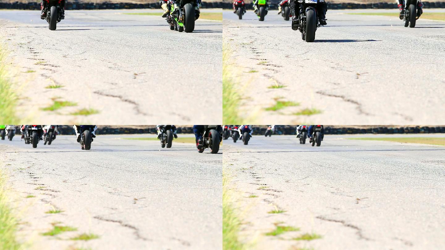 HD：一群摩托车在跑道上比赛。
