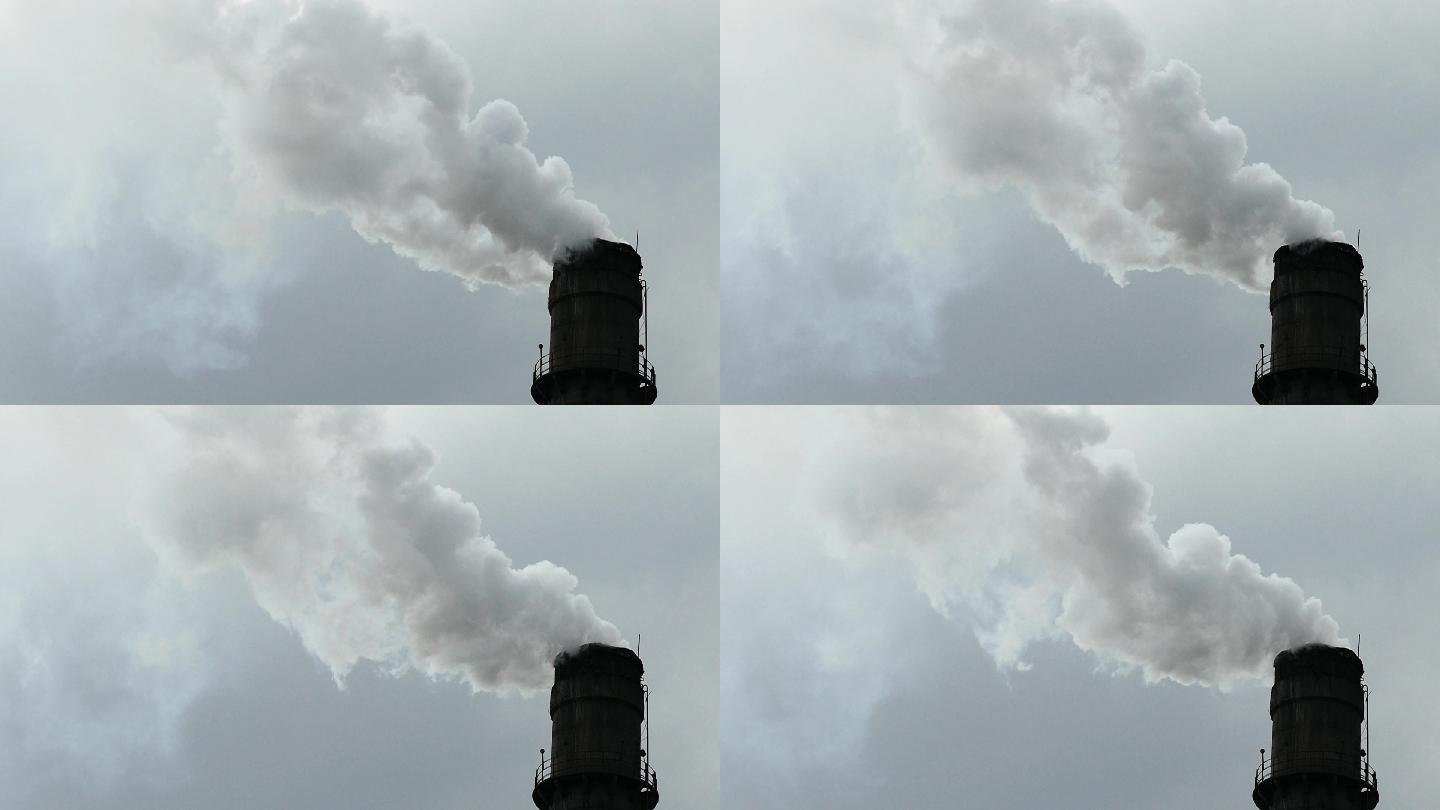 烟囱冒出的烟慢慢地移动，污染了环境
